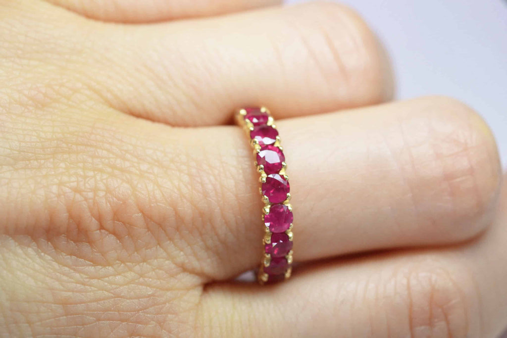 Eternity Ring: Round Ruby Eternity Band in 18k Yellow Gold
